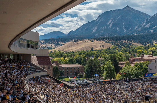 A photo of a full stadium at Folsom Field in Colorado, the seats filled with fans ready to watch a Buffs football match.